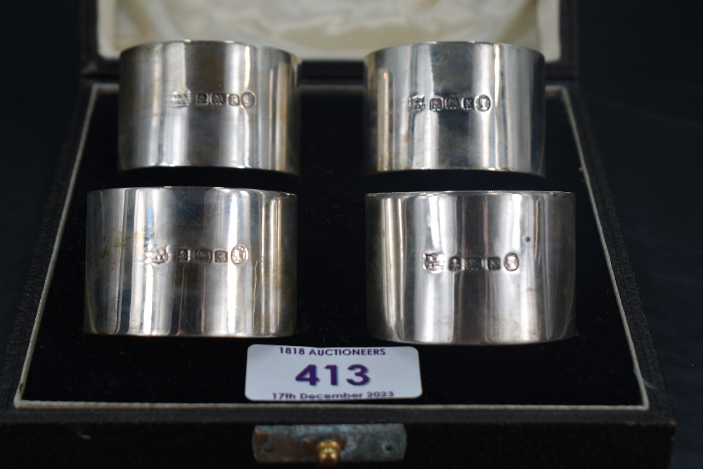 A cased set of four George V silver napkin rings, of plain cylindrical form with marks for - Image 2 of 2