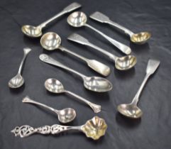 A group of mixed silver condiment spoons, to include George III, Scottish, Victorian, and Art