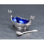 A Norwegian .925 Sterling grade silver longboat form salt, with Bristol blue glass liner and