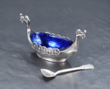 A Norwegian .925 Sterling grade silver longboat form salt, with Bristol blue glass liner and