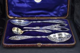 A good quality cased Victorian silver-plated fruit serving set, comprising grape scissors, two
