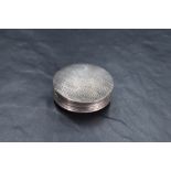 A Dutch silver pill box, of reeded circular form with vacant shield form cartouche, second