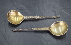 Two interesting 17th/18th century Scandinavian gilt metal apostle spoons, each with circular