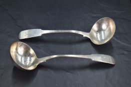 A pair of George III silver fiddle pattern sauce ladles, engraved with initial C to terminals, third
