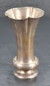 An Edwardian silver vase, of lobed and flared cylindrical form with short basel knop and spreading