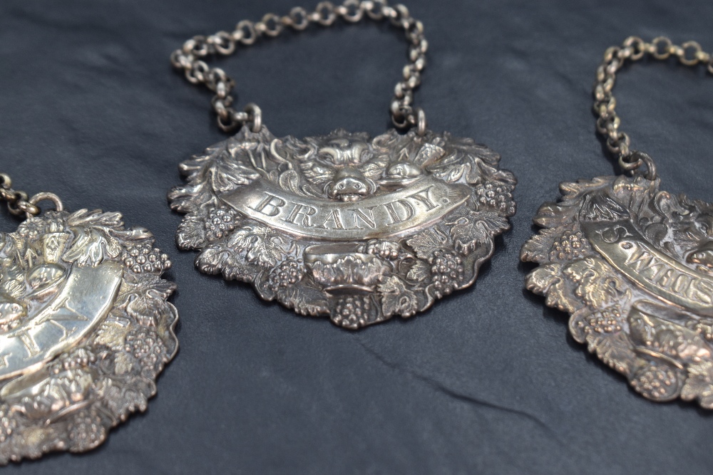A group of three George IV silver spirit labels, embossed with Sanglier head within an arsenal of - Image 2 of 4