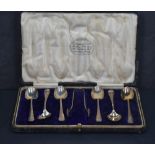 A cased set of six George V silver Hanovarian pattern teaspoons and sugar tongs with rat tail