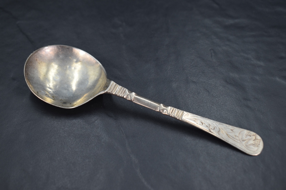An unusual 17th/18th century Scandinavian white metal spoon, the shallow circular bowl issuing a