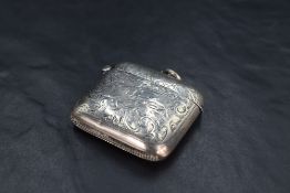 An Edwardian silver vesta case, of hinged rectangular form curved for the gentleman's pocket and