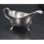 A Queen Elizabeth II silver sauce boat, of traditional form with reeded foliate ornamented rim,