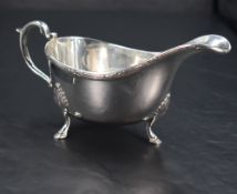 A Queen Elizabeth II silver sauce boat, of traditional form with reeded foliate ornamented rim,