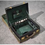 A Victorian green-stained leather travelling vanity case, the cover with gilt tooled initials F.S