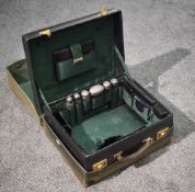 A Victorian green-stained leather travelling vanity case, the cover with gilt tooled initials F.S
