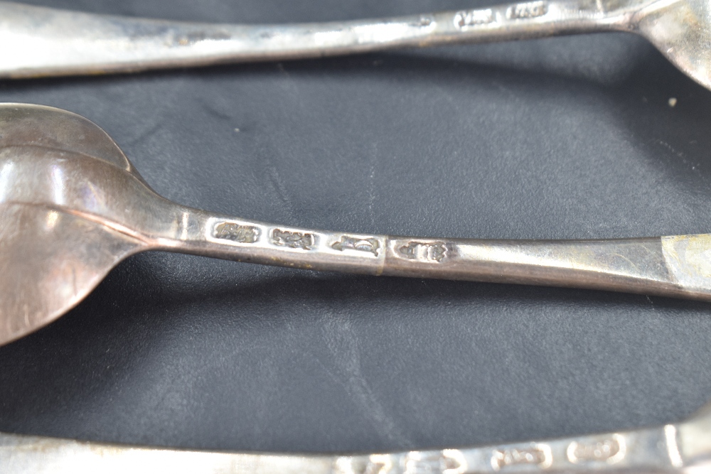 Three George II silver Old English pattern table spoons, the terminals engraved with crest 'A Dexter - Image 4 of 5