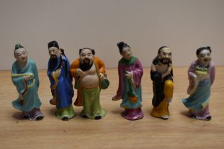 A group of six Chinese porcelain figures depicting deities, measuring 10cm tall