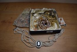 An assorted collection of simulated pearl necklaces, and other decorative jewellery