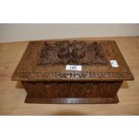 A late 19th Century carved oak table box, measuring 15cm x 28cm x 16cm