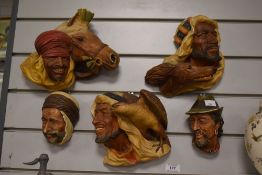 A group of five Bossons chalkware head plaques, including Desert Hawk and Desert King