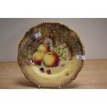 A 20th Century Royal Worcester hand painted Fruit Study plate, signed P.Platt, and heightened with