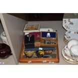 An assorted collection of costume jewellery and watches, including brooches, wristwatches by Timex