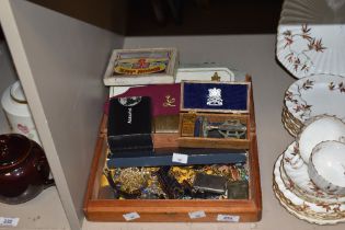 An assorted collection of costume jewellery and watches, including brooches, wristwatches by Timex