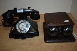 A mid century plastic rotary dial telephone.