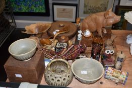 An assorted collection of treen, including a seated pig ornament, studio ceramics, an oriental