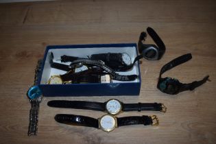 A tub of miscellaneous wristwatches, including a digital La Belle watch, plus watches by Lorus,