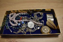 An assorted collection of costume jewellery, including a white metal Celtic style brooch, a polished