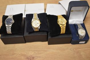 Four boxed stainless steel Citizen Automatic wristwatches, with boxes