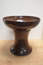 A vintage brown glazed stoneware jardiniere stand and pedestal.