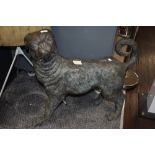 A cast bronze sculpture in the form of a 19th Century pug, patinated in appearance, and measuring