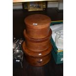 A group of three mid-20th Century graduating leather hat boxes, the largest with a diameter of 35cm