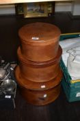 A group of three mid-20th Century graduating leather hat boxes, the largest with a diameter of 35cm
