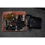 A box of assorted cameras and accessories, including Canon, pairs of binoculars, by Boots Ascot &