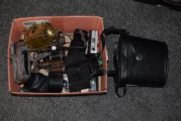 A box of assorted cameras and accessories, including Canon, pairs of binoculars, by Boots Ascot &