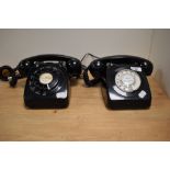 Two vintage rotary dial telephones, having been converted to modern wiring.