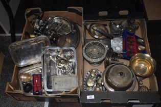 Two boxes of silver plated ware, to include a rose bowl, flatware, a cruet set, candelabra, and
