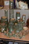 An assorted collection of vintage glass storage jars, to include spaghetti jars and spice jars