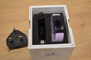 A boxed Your Stride fitness tracker watch