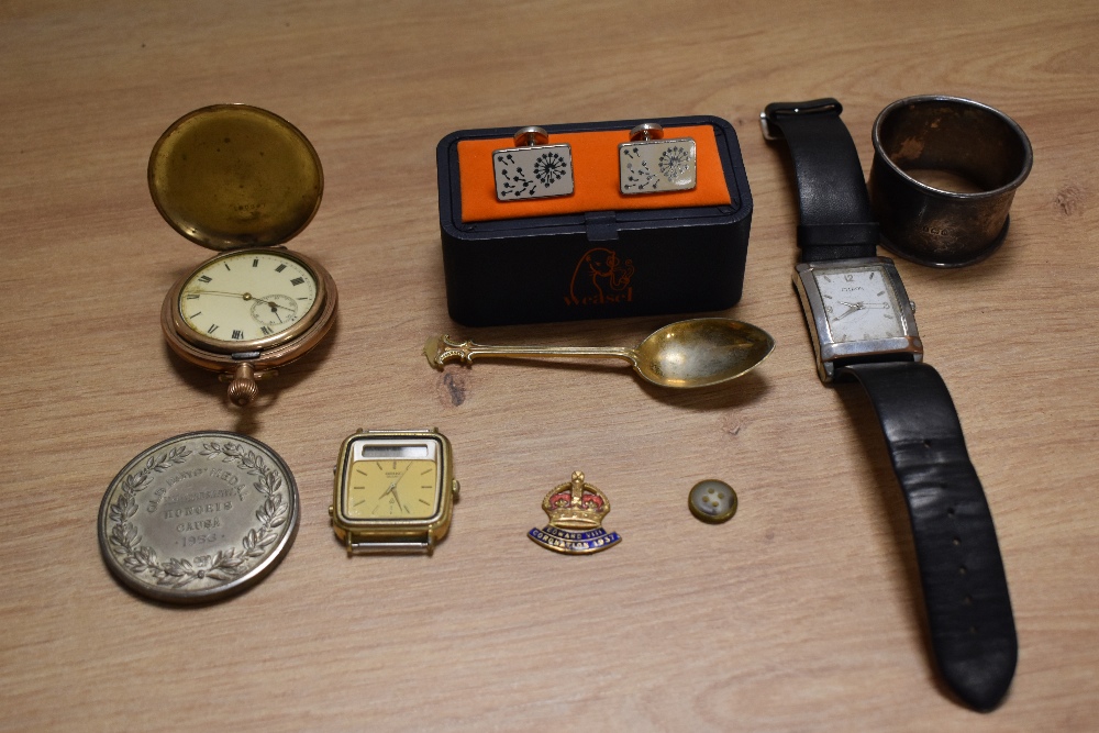 A Waltham pocket watch in gold coloured case, two wristwatches, a Birmingham silver napkin ring