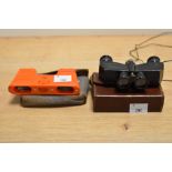 A pair of vintage bakelite opera binoculars, by Kershaw, with case, and another pair by Theatis
