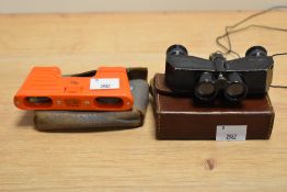 A pair of vintage bakelite opera binoculars, by Kershaw, with case, and another pair by Theatis