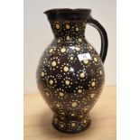A Wetheriggs style pottery vase or jug, dark brown glaze, and measuring 36cm tall