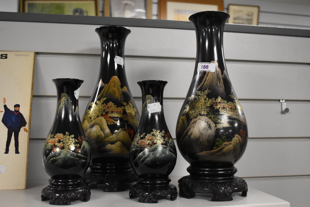 A set of four mid-20th Century Chinese lacquered wood vases, by Flying Horse, the largest measures
