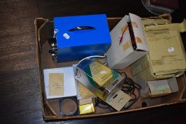 A box of volt meters and other electrical appliances