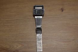 A vintage Casio alarm chronograph wristwatch with stainless steel strap