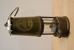 A 20th Century Eccles Type 6 miner's safety lamp, measuring 25cm tall
