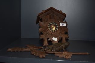 A mid-20th Century German Forestall cuckoo clock, in the Black Forest style, with ebonised chapter