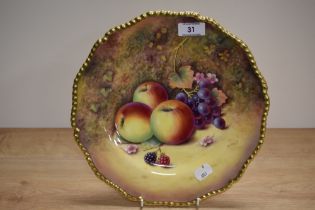 A 20th Century Royal Worcester hand painted Fruit Study plate, signed P.Platt, and heightened with